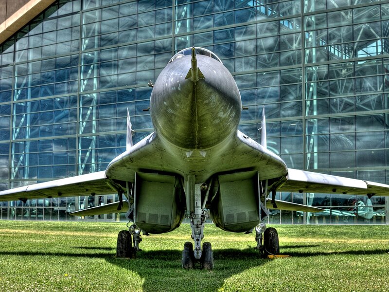 Military Jet on Display — Green, Dramatic