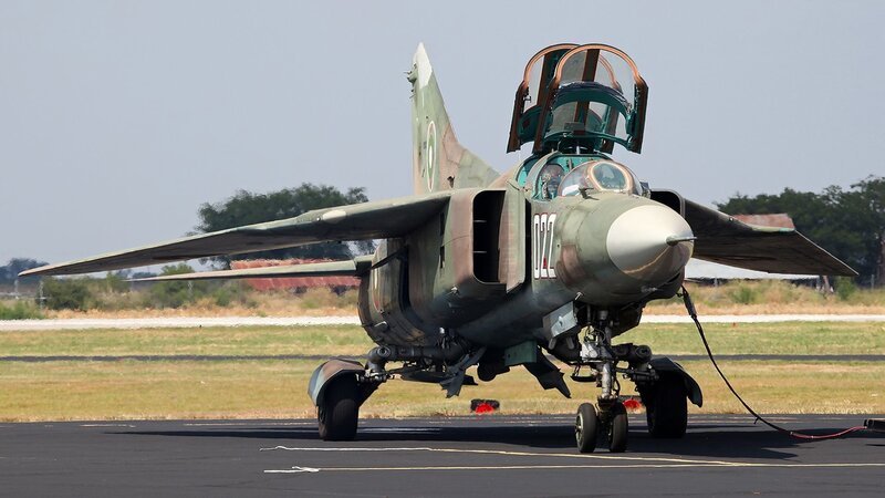 Military Jet on Runway — Green, Neutral