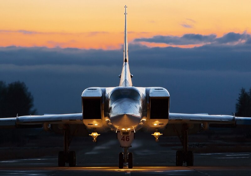 Military Jet on Runway — Orange, Dramatic
