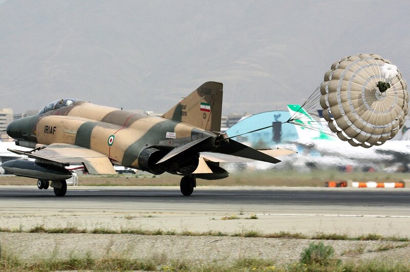 Military Jet on Runway — Tan, Dramatic