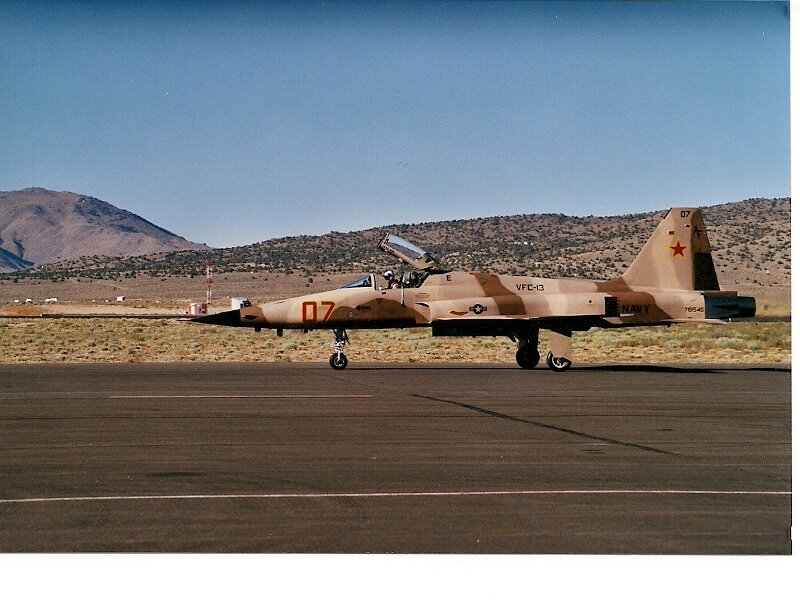 Military Jet on Runway — Tan