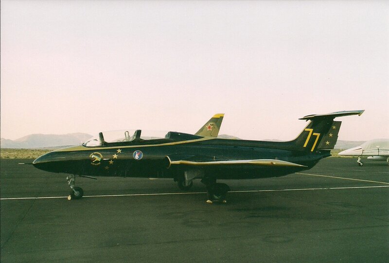 Military Jet on Tarmac — Black, Calm