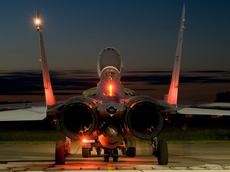 Military Jet on Tarmac — Black, Dramatic