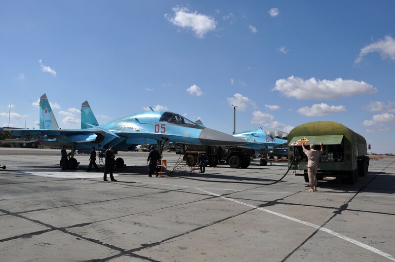 Military Jet on Tarmac — Blue, Neutral, Afternoon