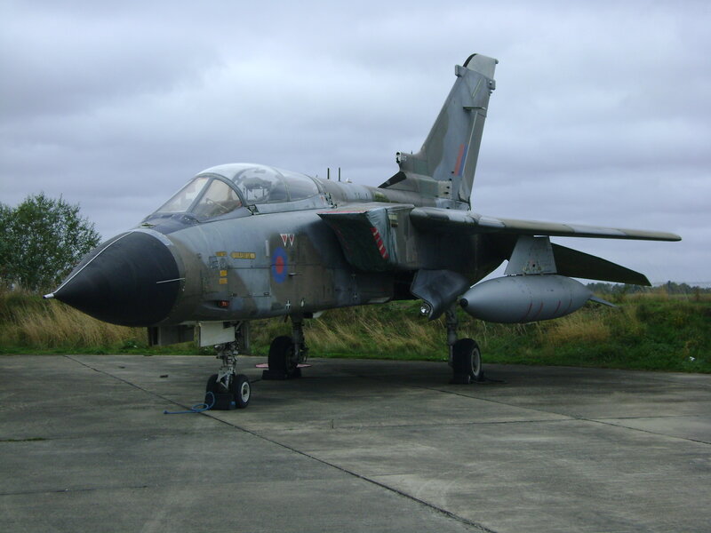 Military Jet on Tarmac — Gray, Overcast