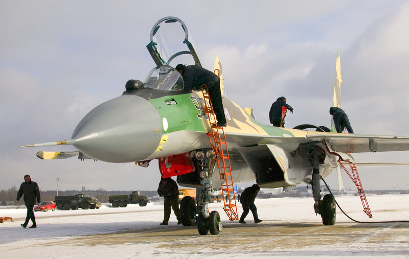 Military Jet on Tarmac — Green, Cold