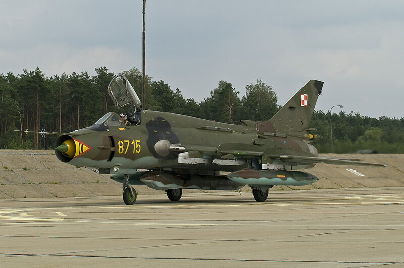 Military Jet on Tarmac — Green, Neutral, Afternoon, Photograph