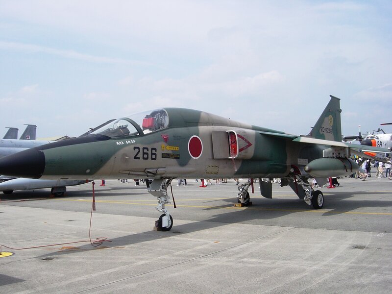 Military Jet on Tarmac — Green, Neutral
