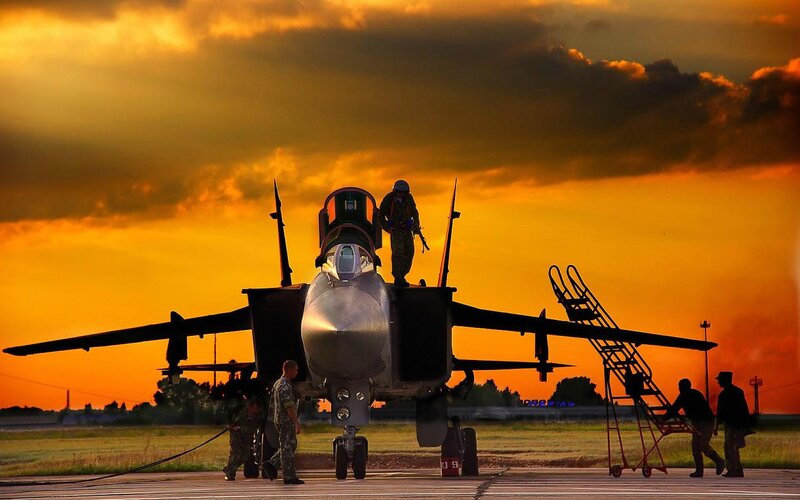 Military Jet on Tarmac — Orange, Dramatic, Sunset