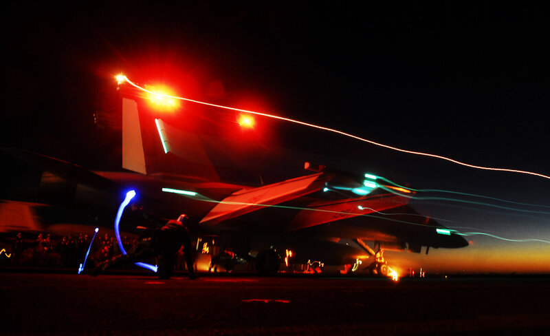 Military Jet on Tarmac — Red