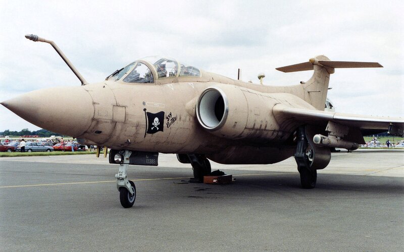 Military Jet on Tarmac — Tan