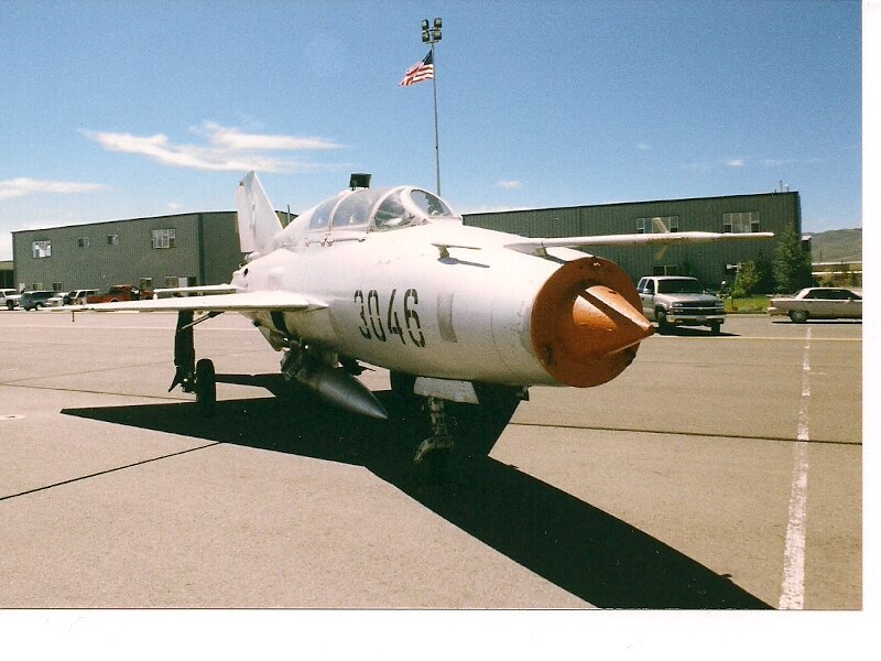 Military Jet on Tarmac — White