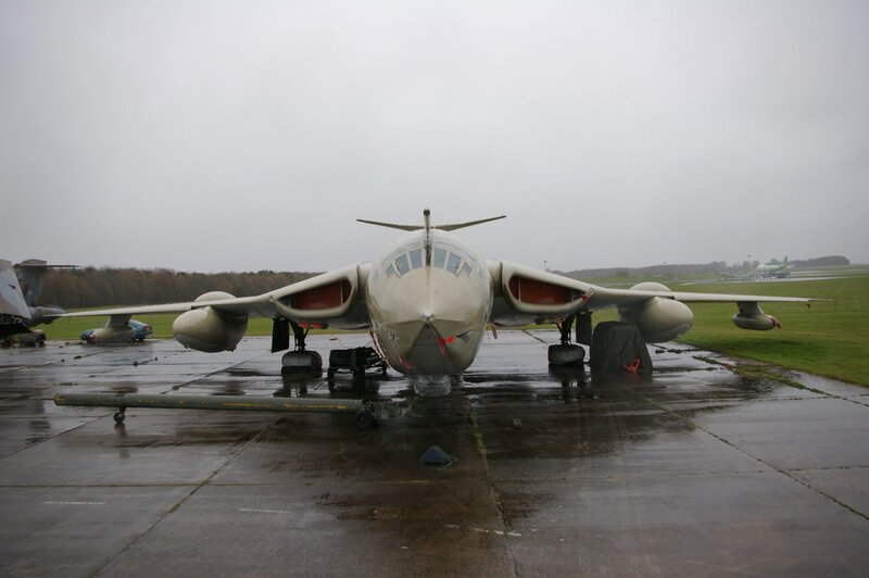 military jet on wet tarmac