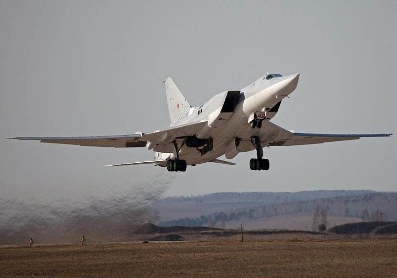 Military Jet Taking Off — White