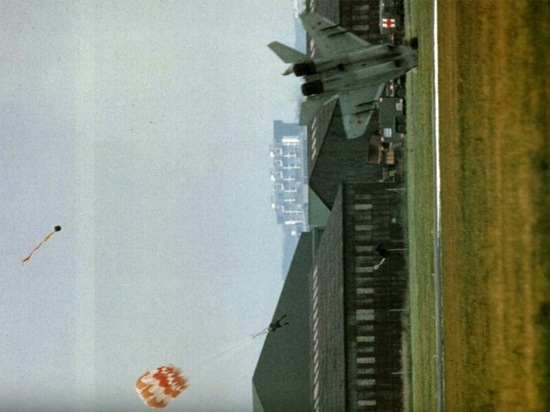 Military Jet with Parachutes