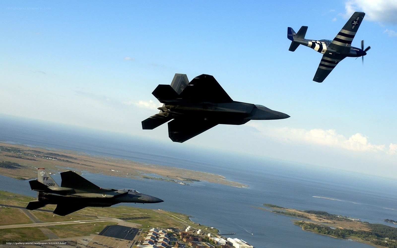 Military jets in formation over coast