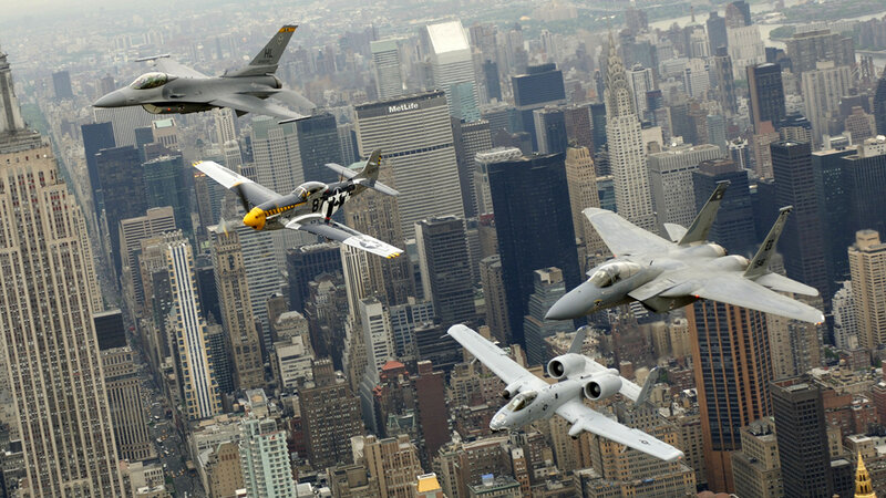 Military jets over city skyline