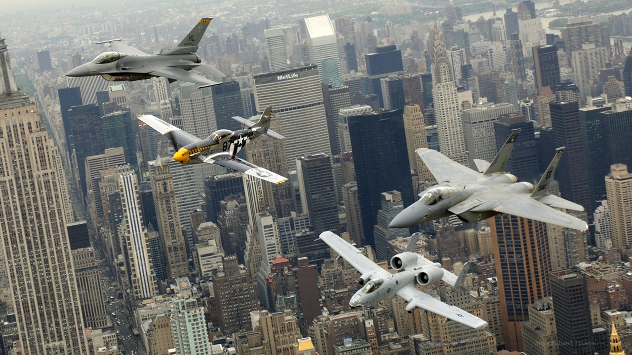 Military jets over city skyline