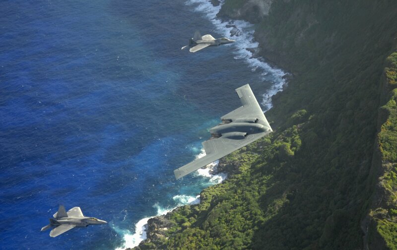 Military jets over coastal terrain