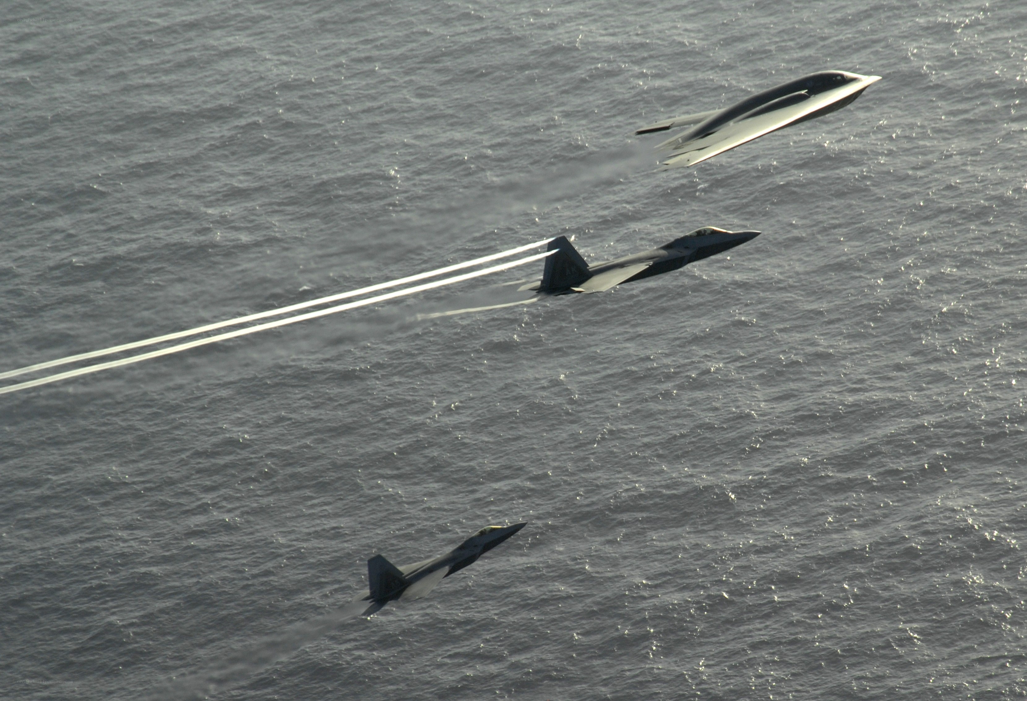 Military jets over ocean