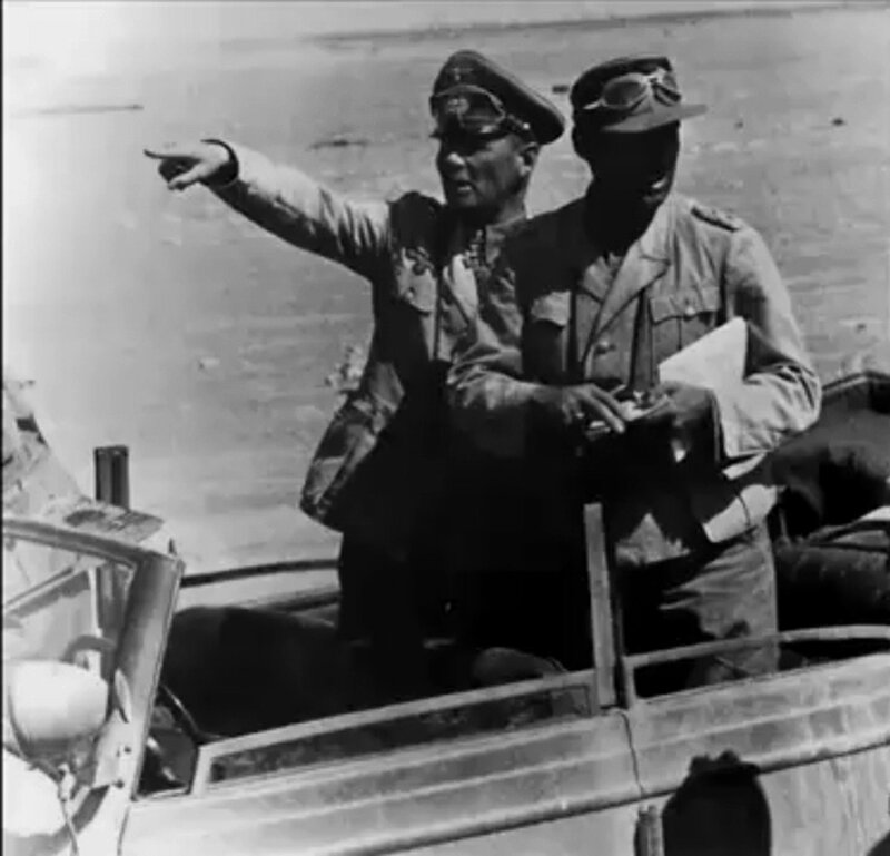 Military leaders in vehicle
