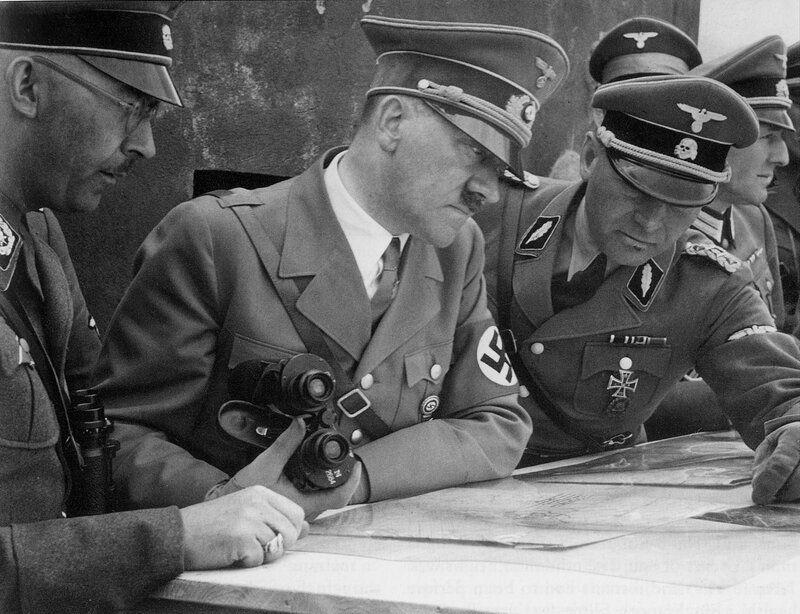 Military leaders reviewing map