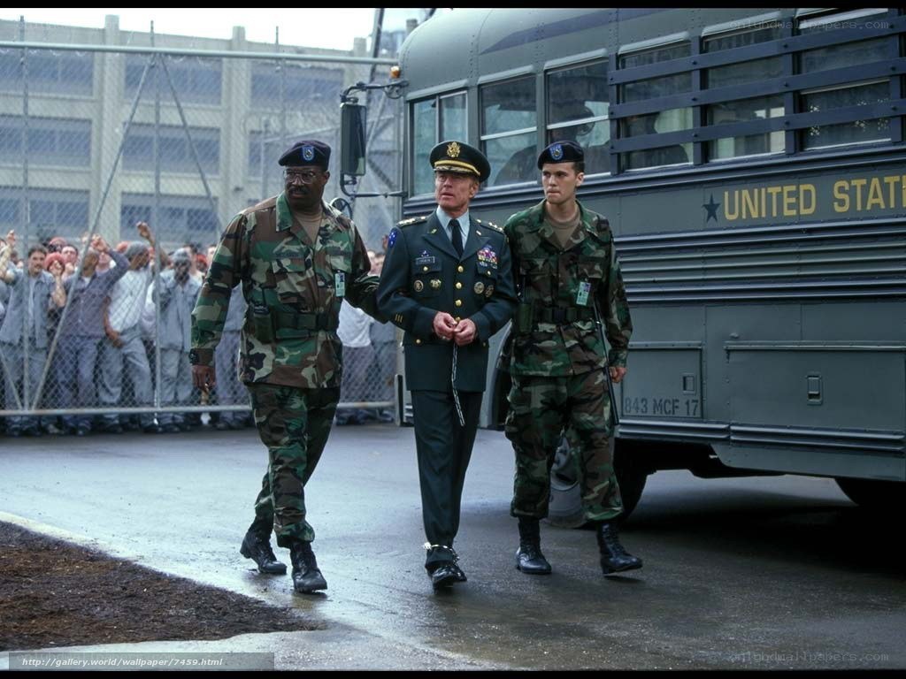 Military officers escorting prisoner