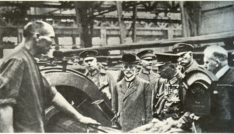 Military officials inspecting artillery