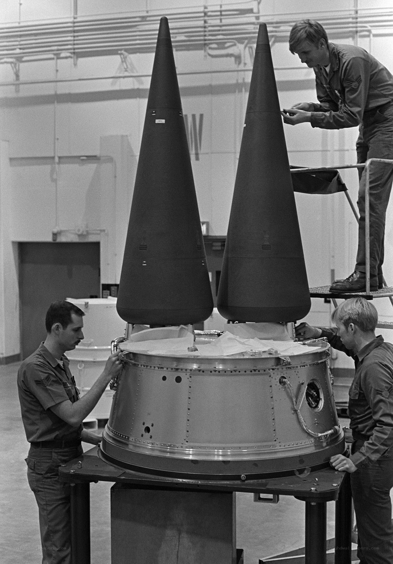 Military personnel assembling missile components