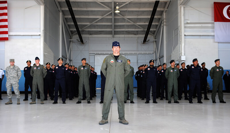 Military personnel in hangar