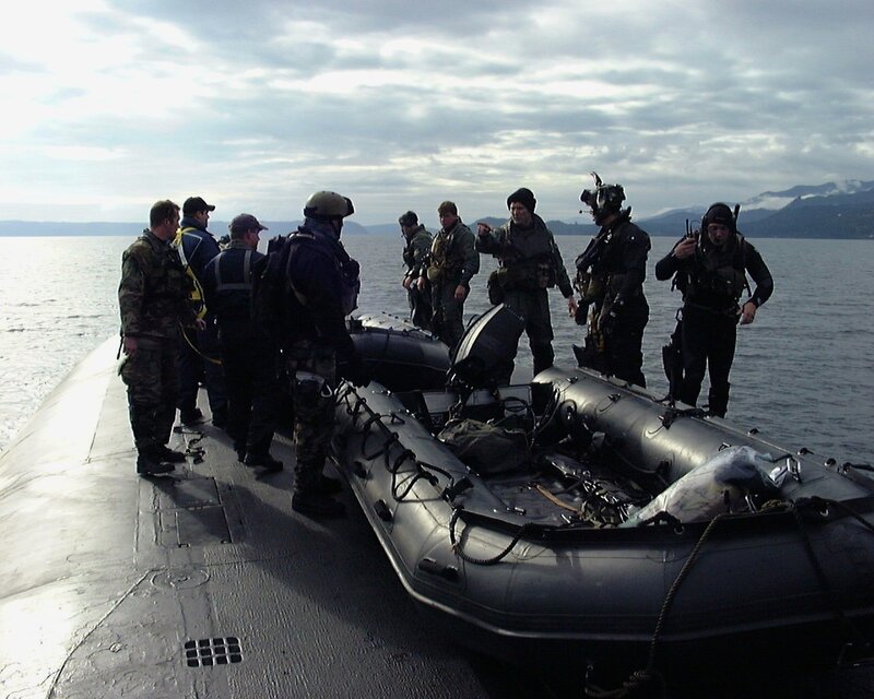 Military personnel on submarine deck