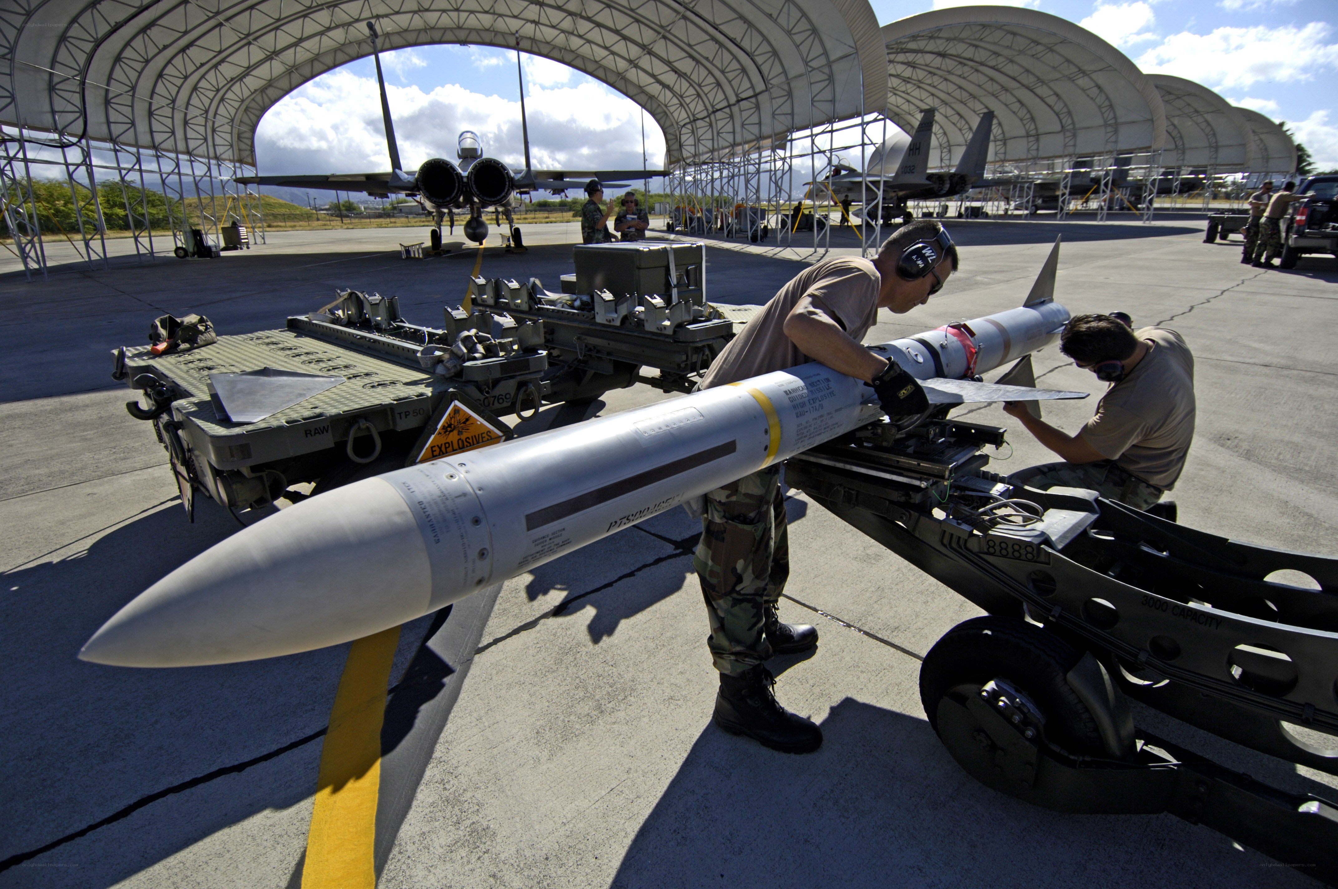 Military personnel preparing missile