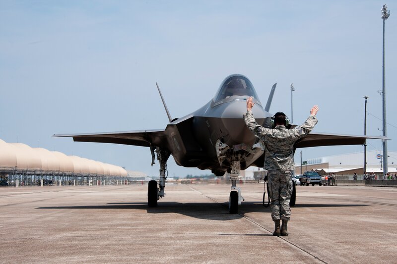 Military Personnel with Jet
