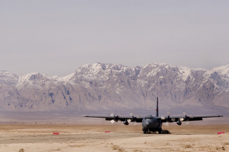 Military plane on desert runway