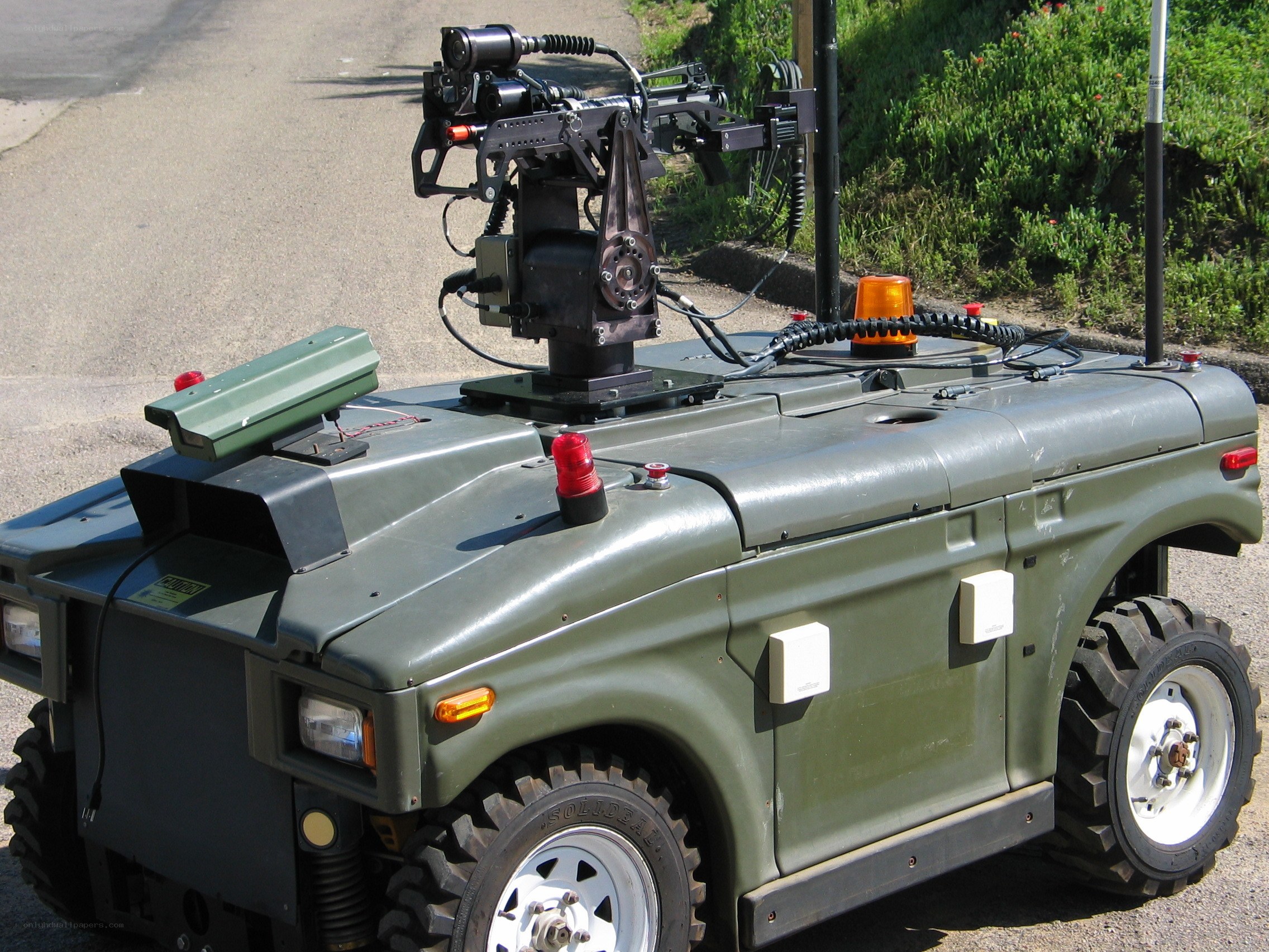 Military robot with mounted weapon