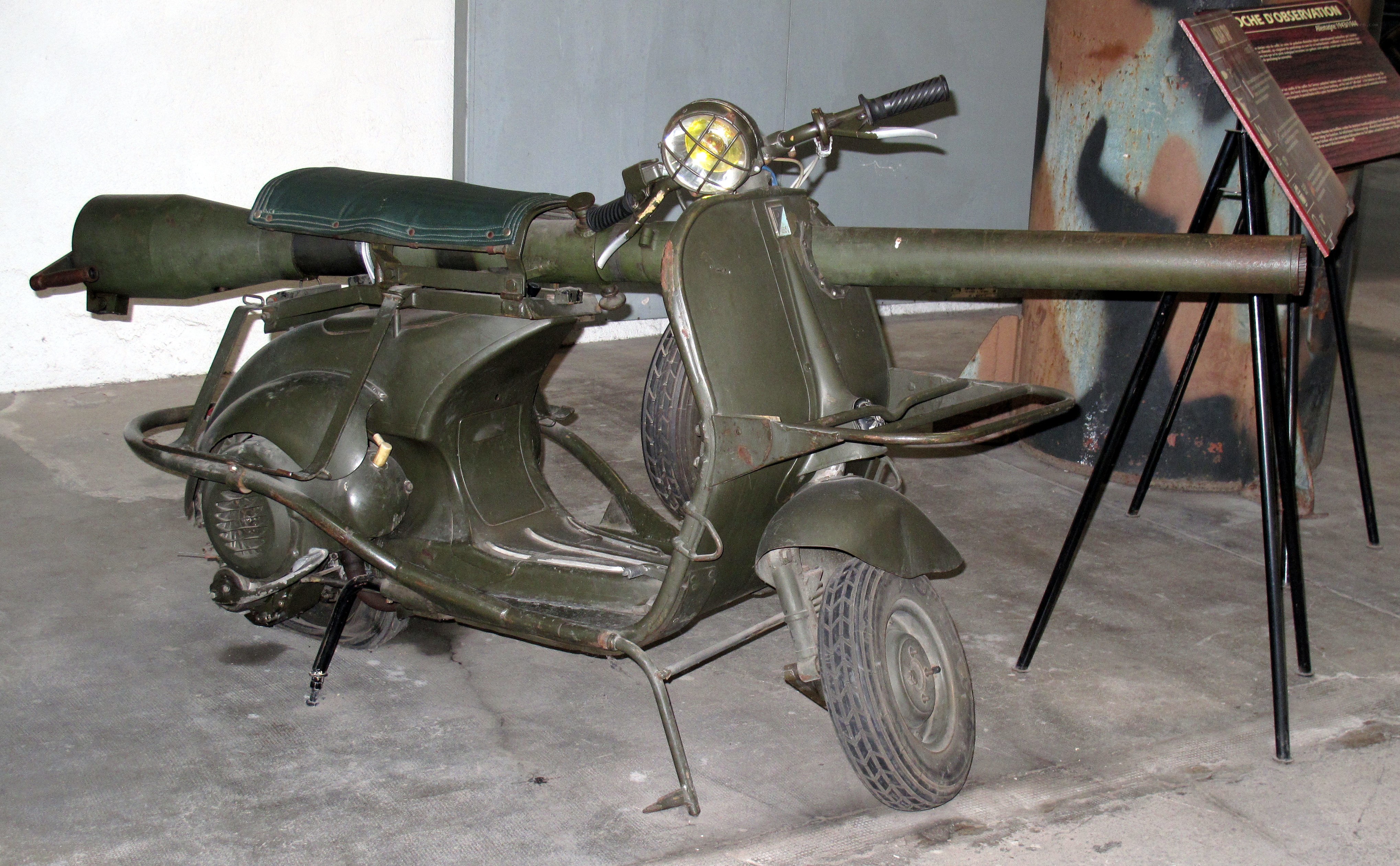 Military scooter with mounted weapon