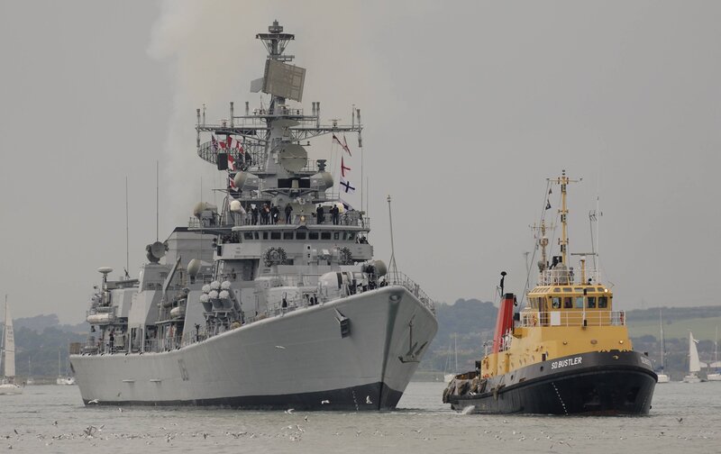 Military Ship and Tugboat