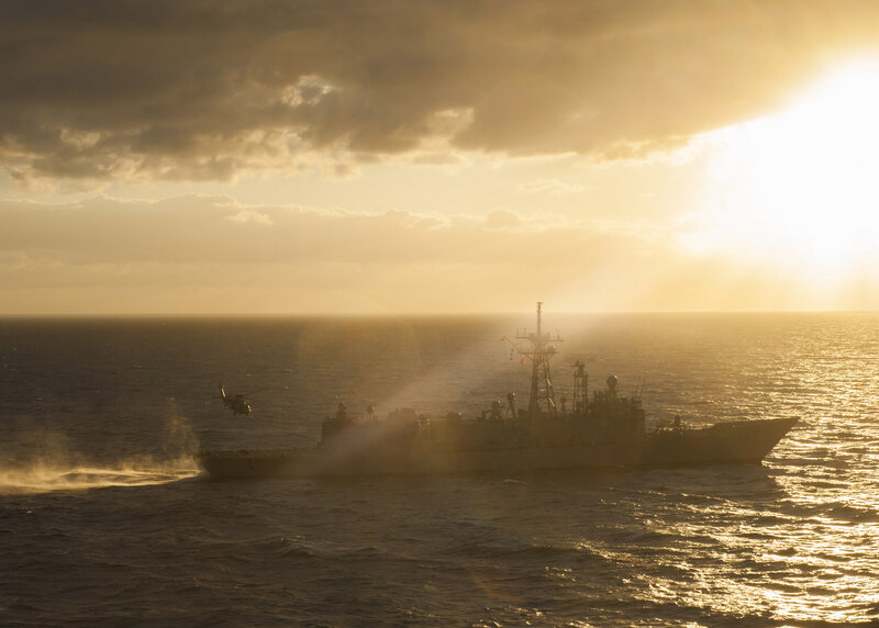 Military Ship at Sea — Gold