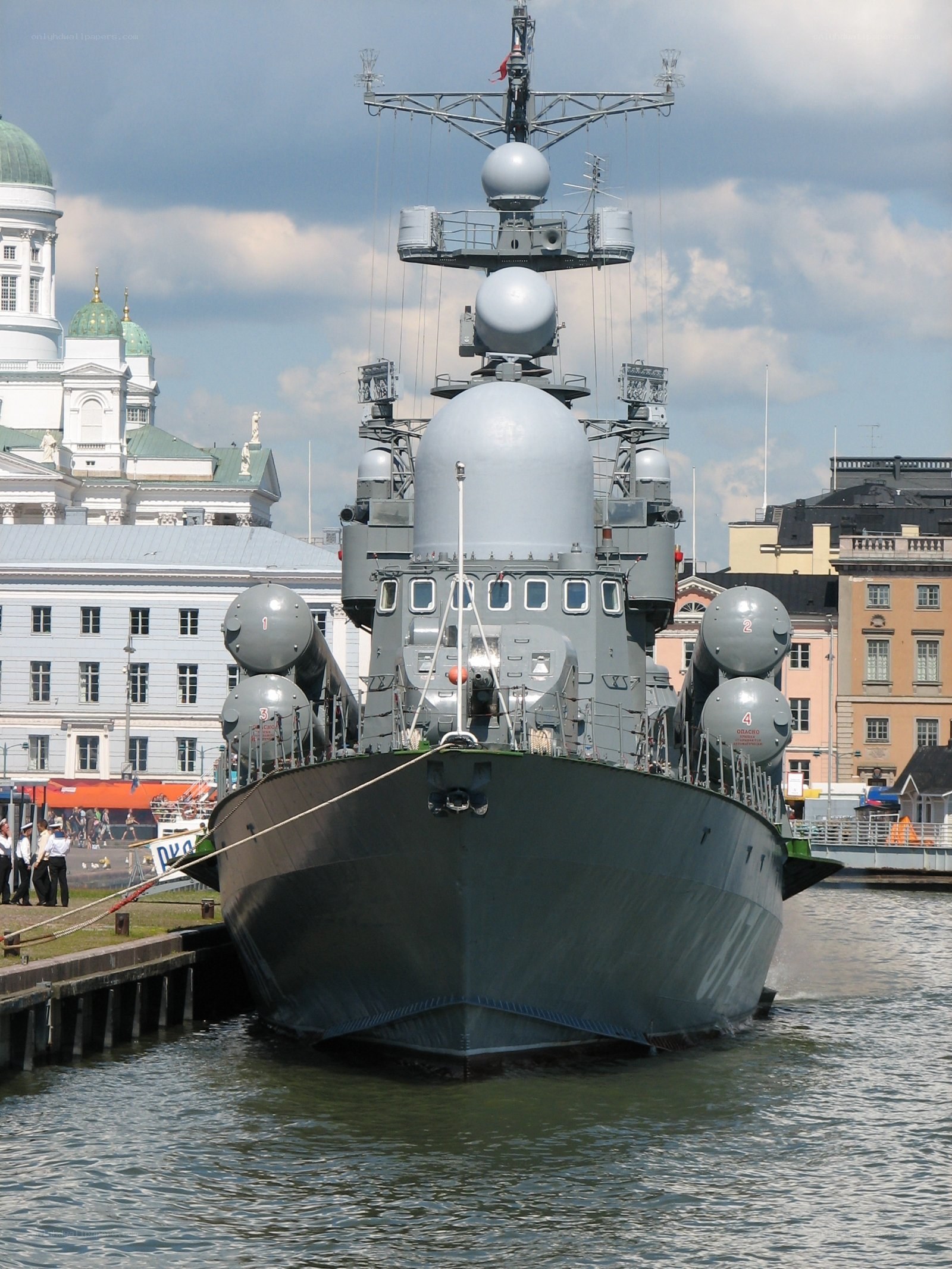 Military ship docked in harbor