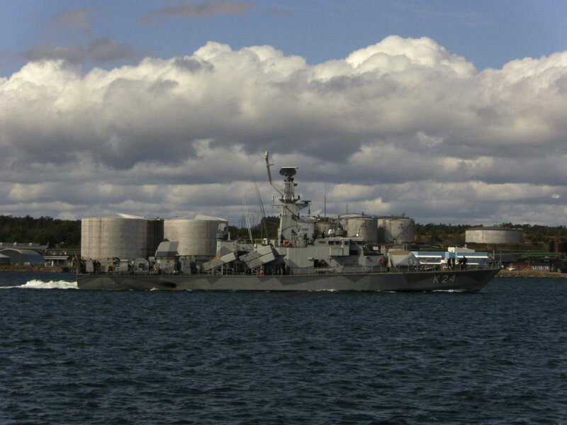 Military ship in coastal waters