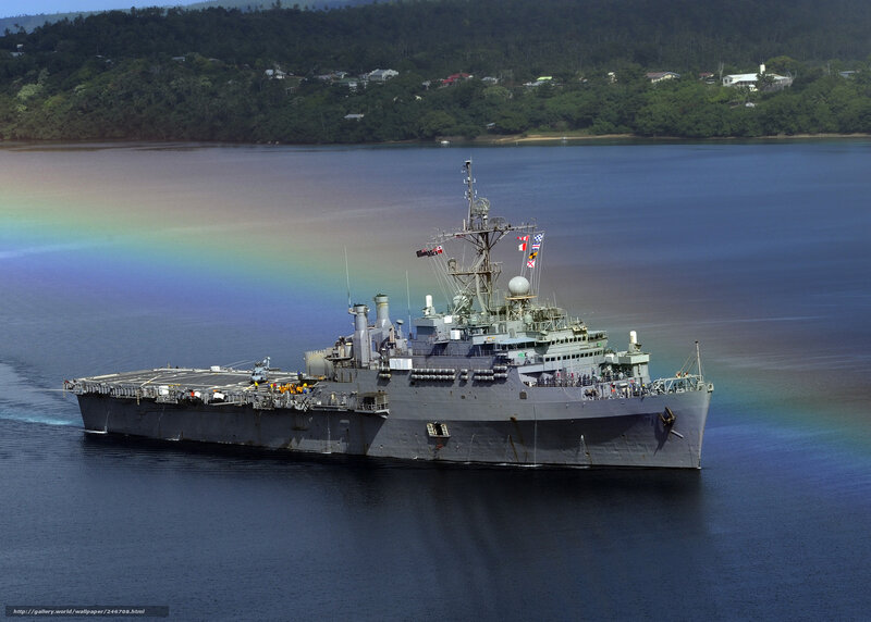 Military ship in harbor with rainbow