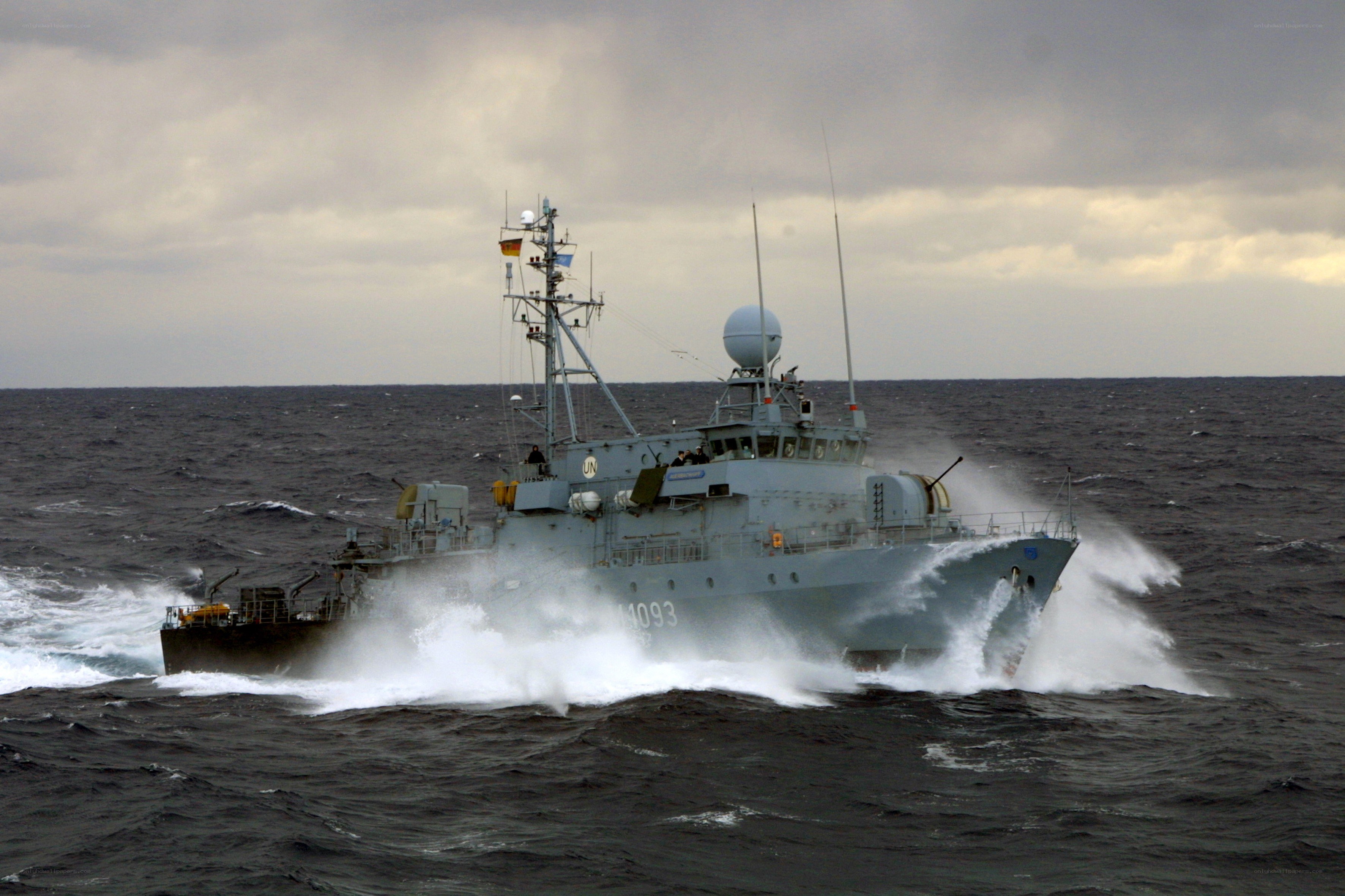 Military ship in rough seas