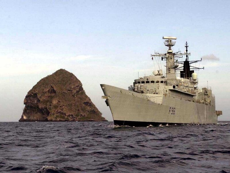 Military Ship Near Rock — Gray