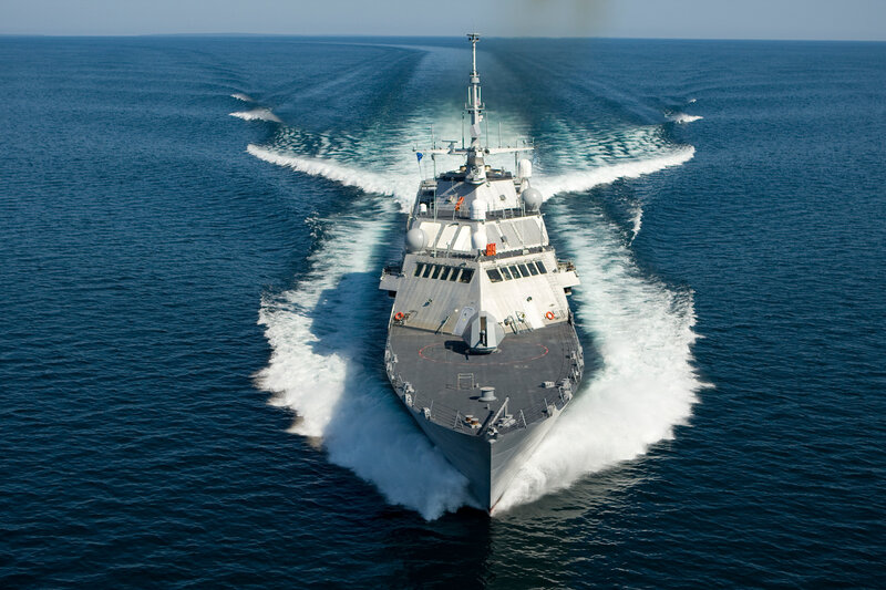 Military ship sailing on open sea