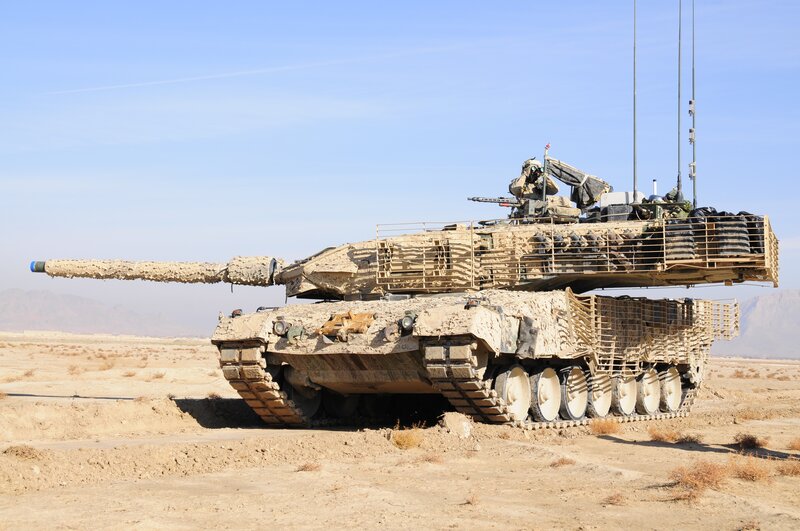 Military tank in desert terrain
