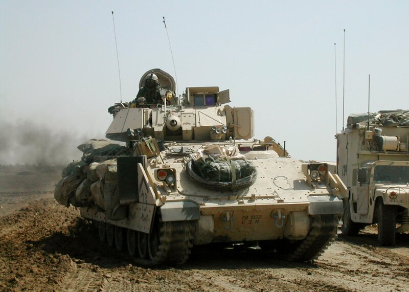 Military tank in desert terrain