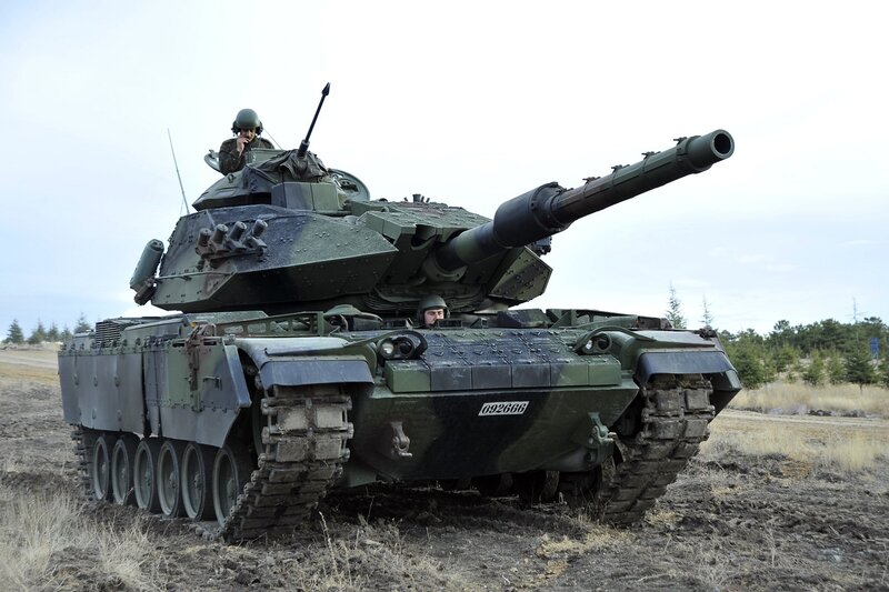 Military tank in field