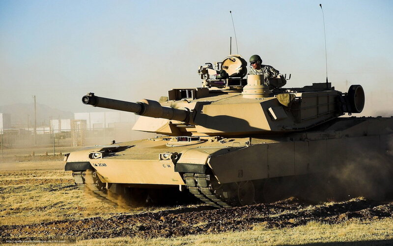 Military Tank in Motion — Tan, Dramatic, Afternoon
