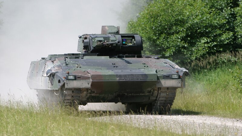 Military tank in motion