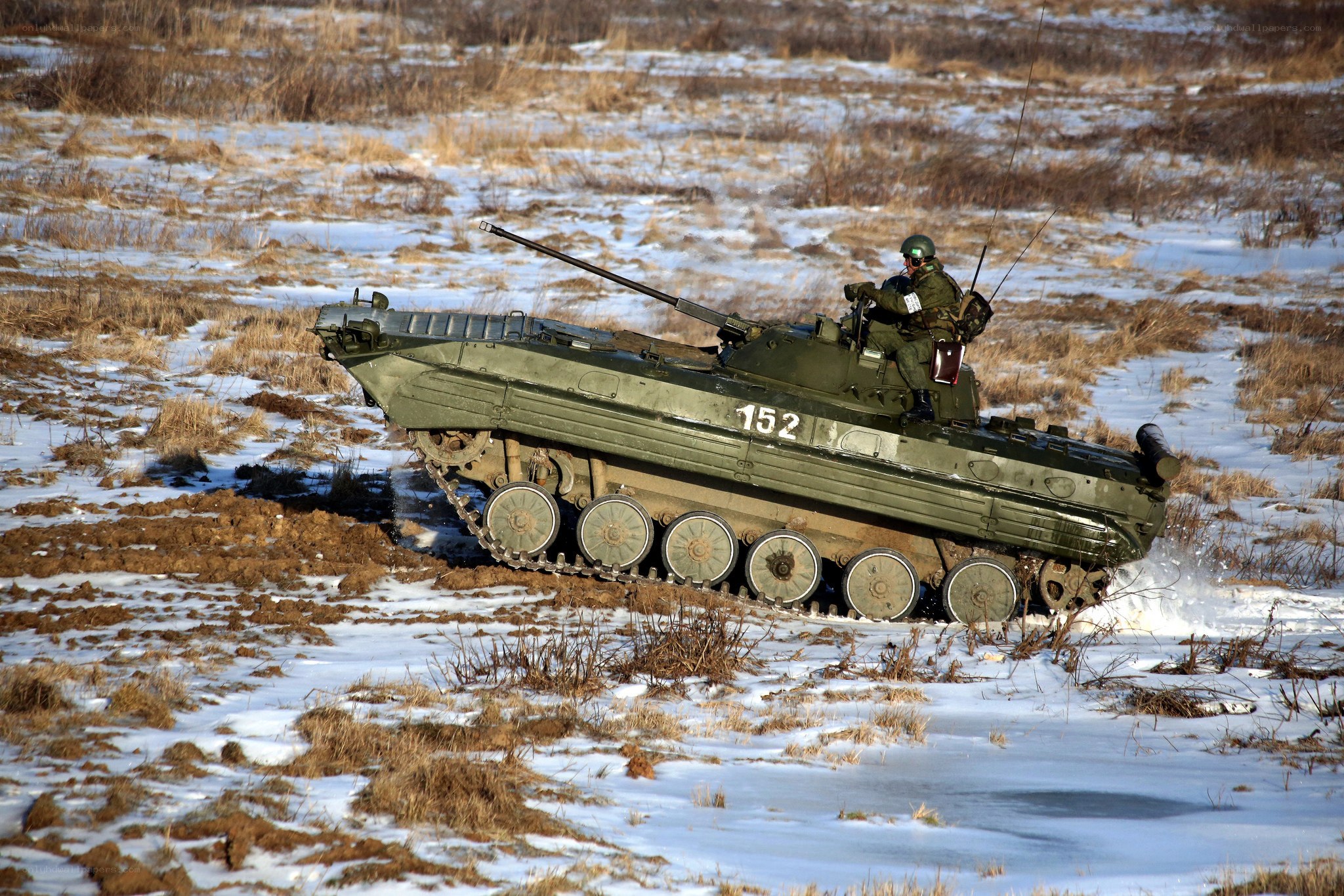 Military tank in snowy field